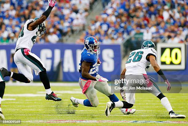 David Wilson of the New York Giants in action against Cary Williams of the Philadelphia Eagles on October 6, 2013 at MetLife Stadium in East...