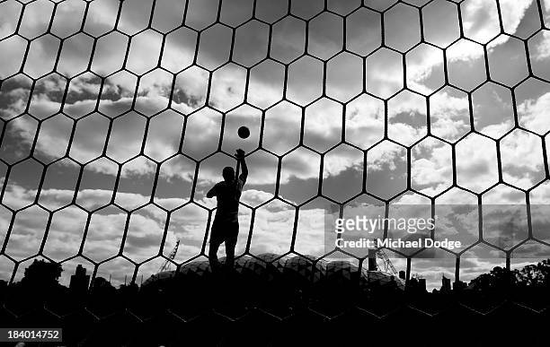 Image has been converted to black and white.) Goal keeper Ashley McGrath stops the ball during an Indigenous Australian International Rules Team...