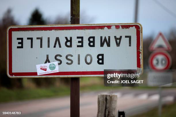 Photograph taken on December 7 shows a road sign indicating the entrance of the French town of Boissy Lamberville, north-western France, which has...