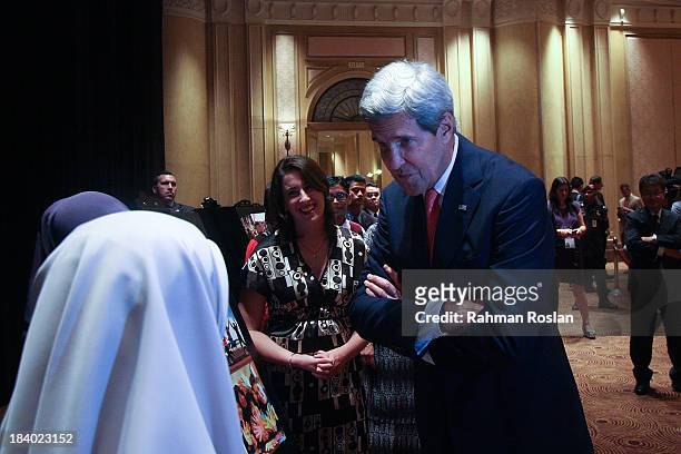 Secretary of State, John Kerry interacts with Fullbright School participants during the Global Entrepreneurship Summit on October 11, 2013 in Kuala...