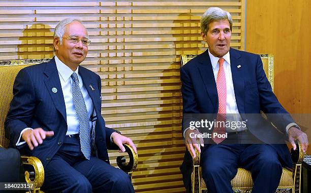 Secretary of State, John Kerry poses with Malaysian Prime Minister, Najib Razak at the Global Entrepreneurship Summit on October 11, 2013 in Kuala...