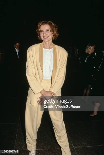 American actress Geena Davis, wearing a yellow trouser suit over a white collarless shirt, attends the Artists' Rights Foundation Gala, held at the...