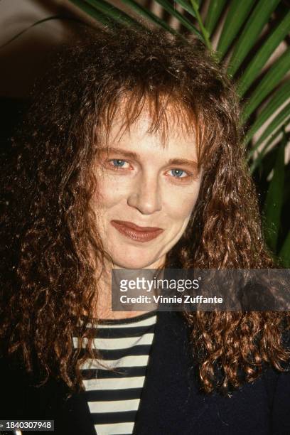 Australian actress Judy Davis, wearing a black jacket over a black-and-white hooped top, attends the 18th Annual Los Angeles Film Critics Association...