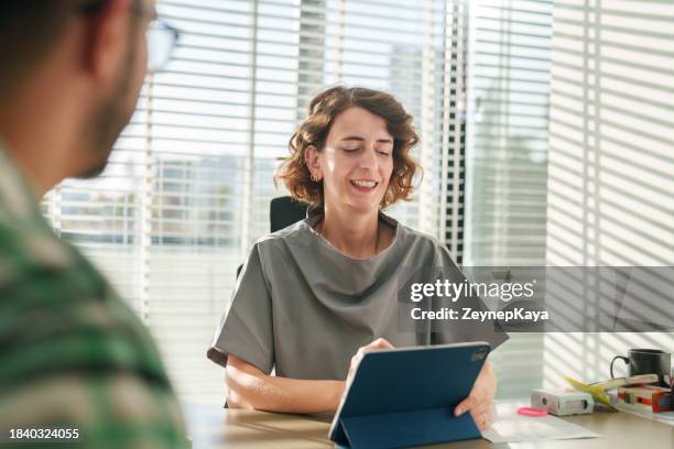 doctor and patient at the office - showus doctor stock pictures, royalty-free photos & images