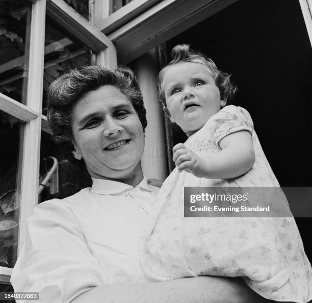 Teacher and Liberal Party politician Renee Soskin holding her baby daughter, June 26th 1958.