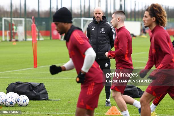 Manchester United's Dutch manager Erik ten Hag takes a team training session at the Carrington Training Complex in Manchester, north-west England on...