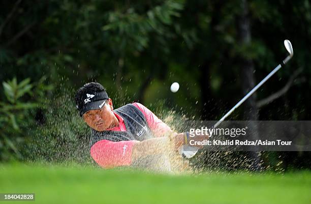 Choi of Korea plays a shot during round two of the CJ Invitational Hosted by KJ Choi, at Haesley Nine Bridges Golf Club on October 11, 2013 in Suwon,...