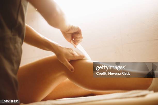 close up of leg waxing stock photo - wax stock pictures, royalty-free photos & images