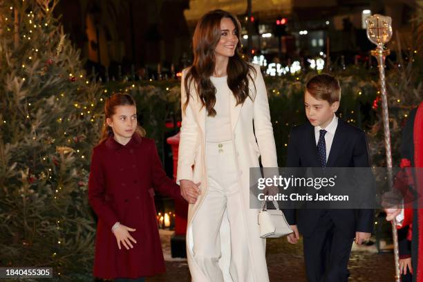 Princess Charlotte of Wales, Catherine, Princess of Wales and Prince George of Wales attend The "Together At Christmas" Carol Service at Westminster...