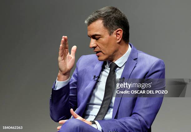 Spain's Prime minister Pedro Sanchez gestures as he talks during the presentation of his new book 'Tierra Firme' in Madrid, on December 11, 2023.