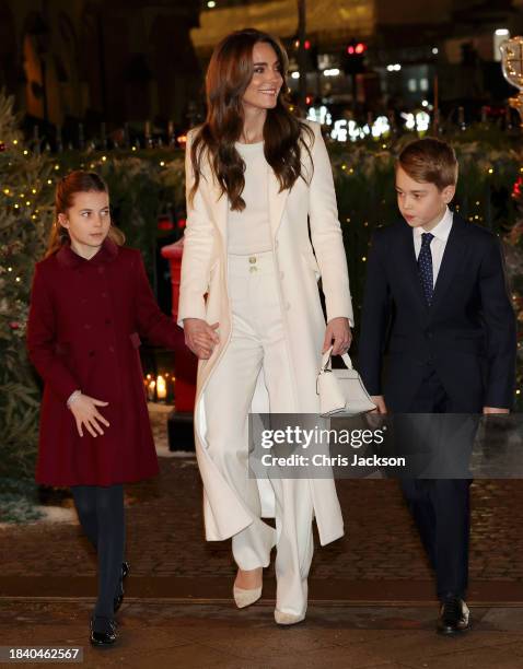 Princess Charlotte of Wales, Catherine, Princess of Wales and Prince George of Wales attend The "Together At Christmas" Carol Service at Westminster...