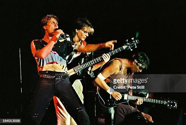 Simon Le Bon, John Taylor and Andy Taylor of Duran Duran perform on stage at Wembley Arena on December 20th, 1983 in London, England.
