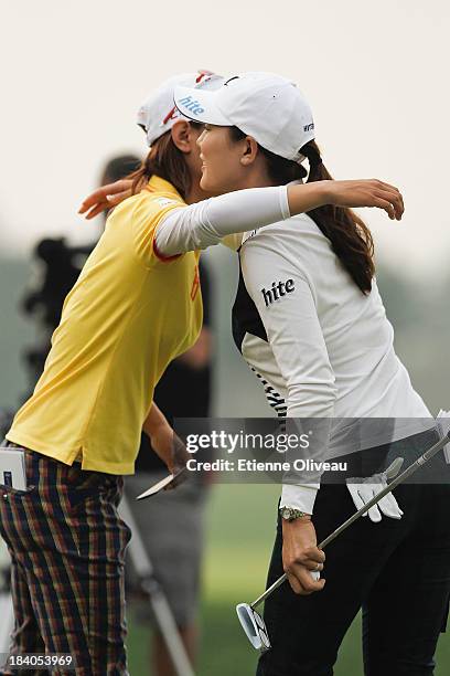 Na Yeon Choi of South Korea and Hee Kyung Seo of South Korea hug at the end of the second round of the Reignwood LPGA Classic at Pine Valley Golf...