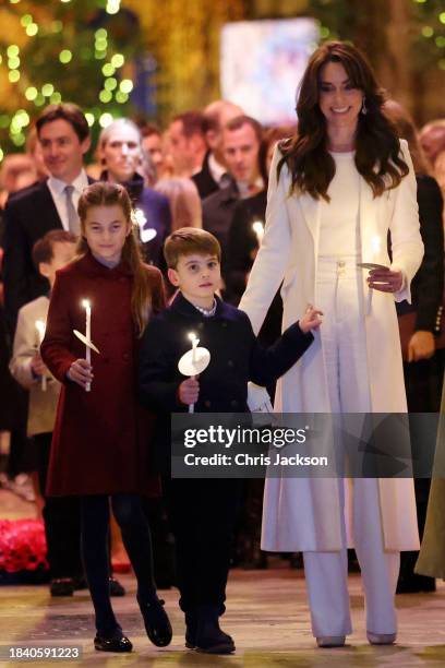Princess Charlotte of Wales, Prince Louis of Wales and Catherine, Princess of Wales attend The "Together At Christmas" Carol Service at Westminster...
