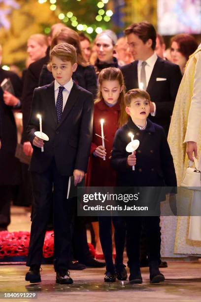 Prince George of Wales, Princess Charlotte of Wales and Prince Louis of Wales attend The "Together At Christmas" Carol Service at Westminster Abbey...