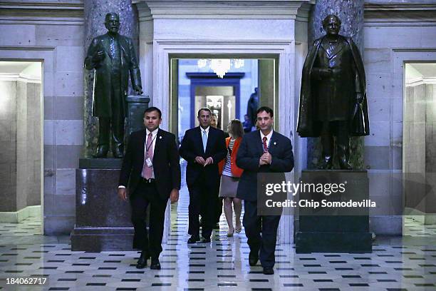 Speaker of the House John Boehner walks through Statuary Hall on his way to the floor of the House of Representatives during the 11th day of the...