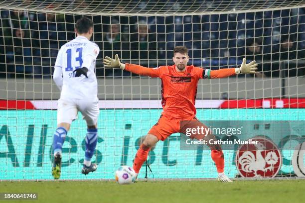 Lars Stindl of Karlsruher SC runs with the ball ahead of scoring his team's second goal past Ron-Robert Zieler of Hannover 96 during the Second...