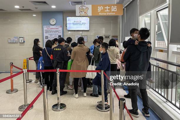 People line up to register in the hospital in Guangzhou, Guangdong province of China on December 11, 2023. Reports indicate that respiratory...