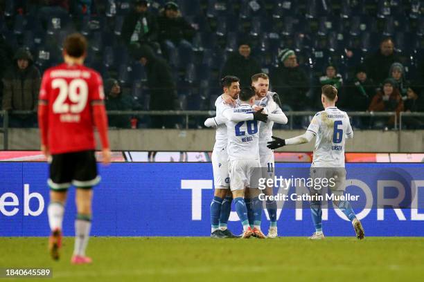 Lars Stindl of Karlsruher SC celebrates scoring his team's second goal with teammates during the Second Bundesliga match between Hannover 96 and...