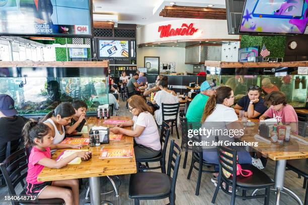 Miami Beach, Florida, Manolo, restaurant, busy dining room with customers eating.