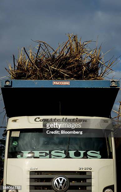 Truck loaded with sugarcane plants waits in line to enter the mill at Unidade Industrial Cruz Alta da Guarani SA's processing plant, near Sao Jose do...