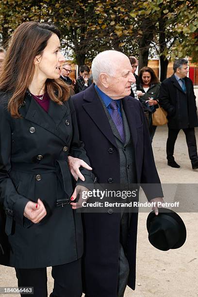 French Culture Minister Aurelie Filippetti and entrepreneur and patron of the arts Pierre Berge, who is the executor of Jean Cocteau's estate, walk...