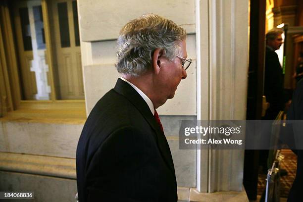 Senate Minority Leader Sen. Mitch McConnell arrives at the U.S. Capitol after a meeting at the White House October 11, 2013 on Capitol Hill in...