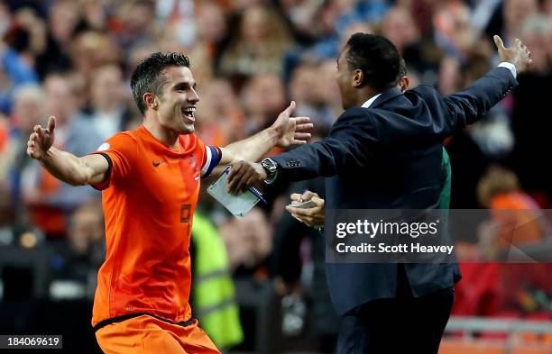 Robin van Persie of Holland celebrates with Patrick Kluivert after scoring their fourth goal during the FIFA 2014 World Cup Qualifing match between...