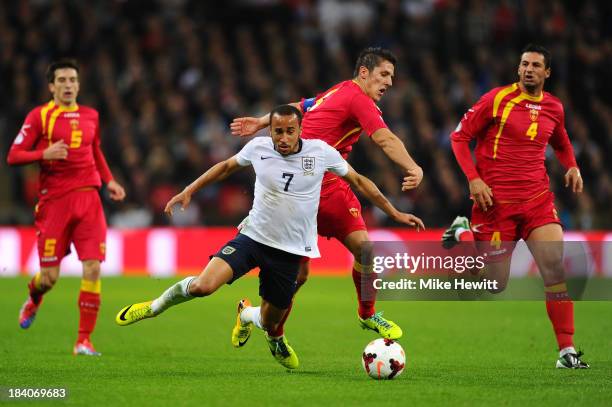 Stevan Jovetic of Montenegro clashes with Andros Townsend of England during the FIFA 2014 World Cup Qualifying Group H match between England and...
