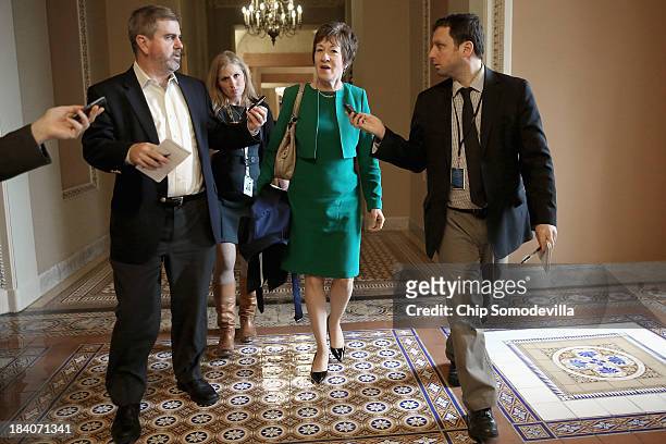 Sen. Susan Collins talks to reporters after leaving a Senate Republican caucus meeting at the U.S. Capitol October 11, 2013 in Washington, DC. Senate...