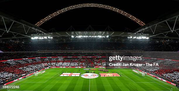 Teams line up for the national anthem ahead of the FIFA 2014 World Cup Qualifying Group H match between England and Montenegro at Wembley Stadium on...