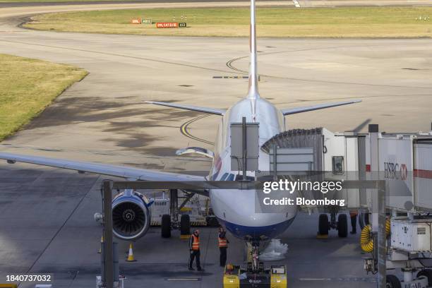 Ground staff prepare an airliner, operated by British Airways Plc, at Heathrow Airport Terminal 5, in London, UK, on Monday, Dec. 11, 2023. Saudi...