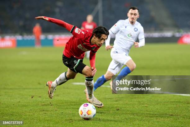 Sei Muroya of Hannover 96 runs with the ball during the Second Bundesliga match between Hannover 96 and Karlsruher SC at Heinz von Heiden Arena on...