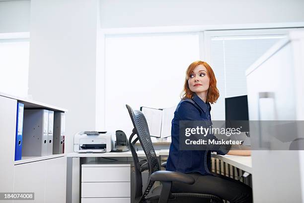 businesswoman sitting at a desk - reykjavik women stock pictures, royalty-free photos & images