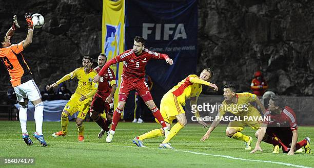 Andorra's Goalkeeper Ferran Pol jumps for the ball during the 2014 FIFA World Cup group D qualifying football match between Andorra and Romania on...