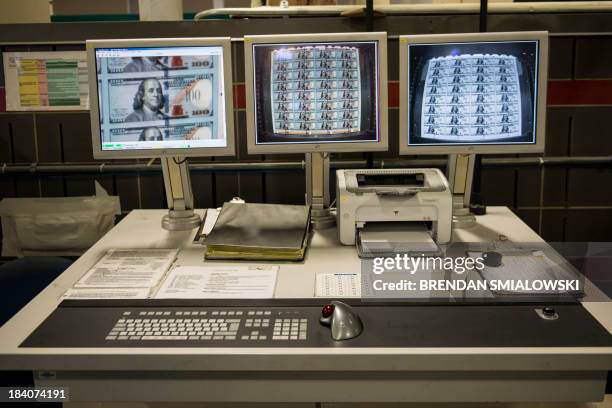 Computer monitors the plate printing operation of the new 100 USD bill at the US Bureau of Engraving and Printing's Western Currency Facility on...