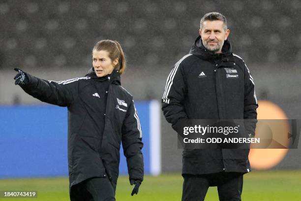 Union Berlin's assistant coach Marie-Louise Eta and Union Berlin's head coach Nenad Bjelica oversee a training session in Berlin on December 11 on...