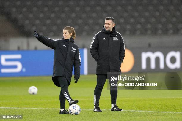 Union Berlin's assistant coach Marie-Louise Eta and Union Berlin's head coach Nenad Bjelica oversee a training session in Berlin on December 11 on...