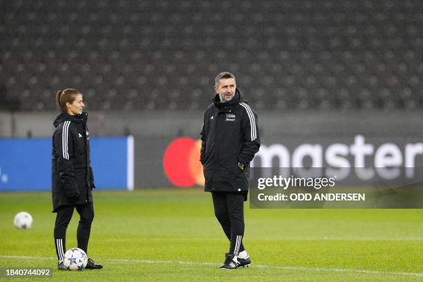 Union Berlin's assistant coach Marie-Louise Eta and Union Berlin's head coach Nenad Bjelica oversee a training session in Berlin on December 11 on...