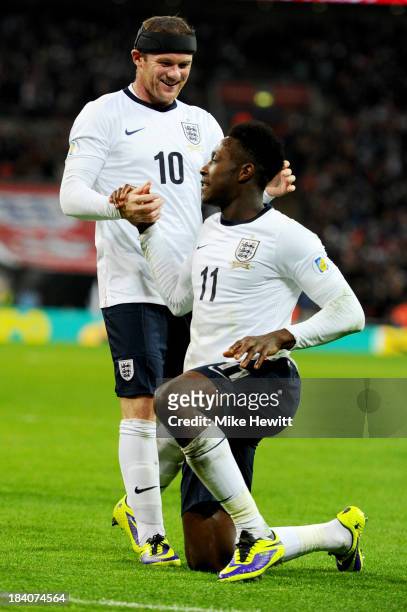 Wayne Rooney of England and Danny Welbeck of England celebrate after Branko Boskovic of Montenegro scored an own goal to make it 2:0 during the FIFA...