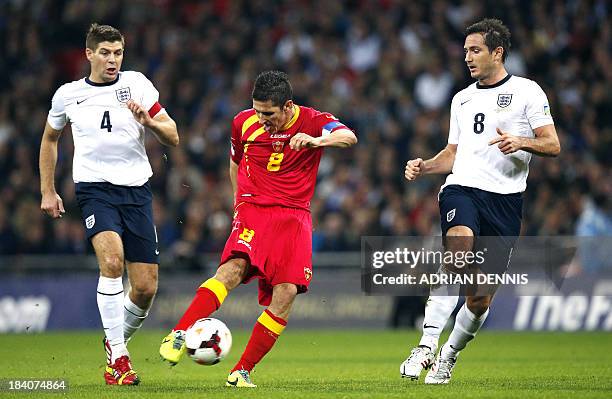 Montenegro's Stevan Jovetic shoots at goal beside England's Frank Lampard and England's Steven Gerrard during the World Cup 2014 Group H Qualifying...