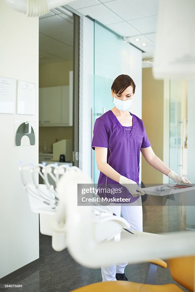 Dentist assistant getting ready for operation