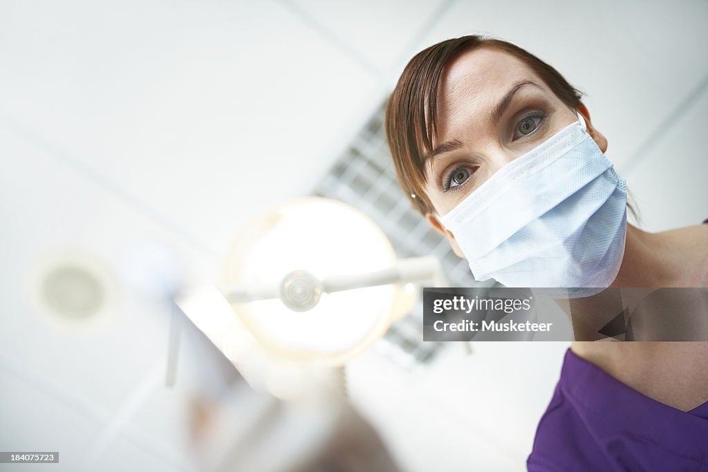 Close up of a dentist operating on a patience
