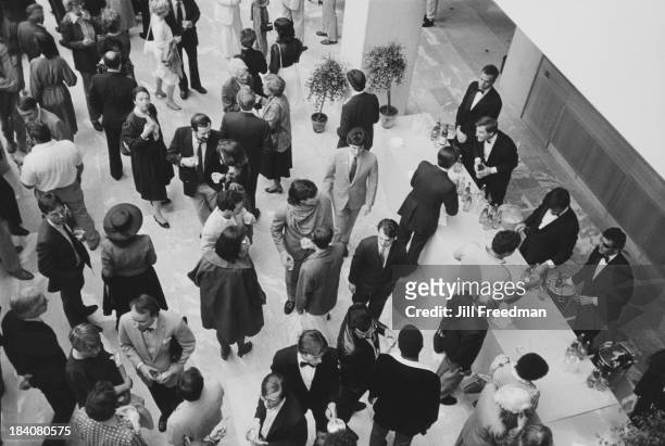 Guests attend an exhibition opening at the Museum of Modern Art, New York City, 1984.