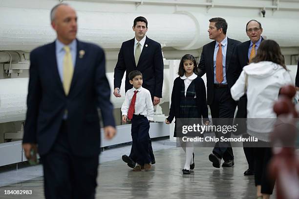 House Budget Committee Chairman Paul Ryan and Rep. Sean Duffy walk with Duffy's nephew and niece through the tunnel to the Longworth House Office...