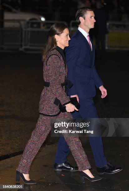 Pippa Matthews and James Matthews attend The "Together At Christmas" Carol Service at Westminster Abbey on December 08, 2023 in London, England.