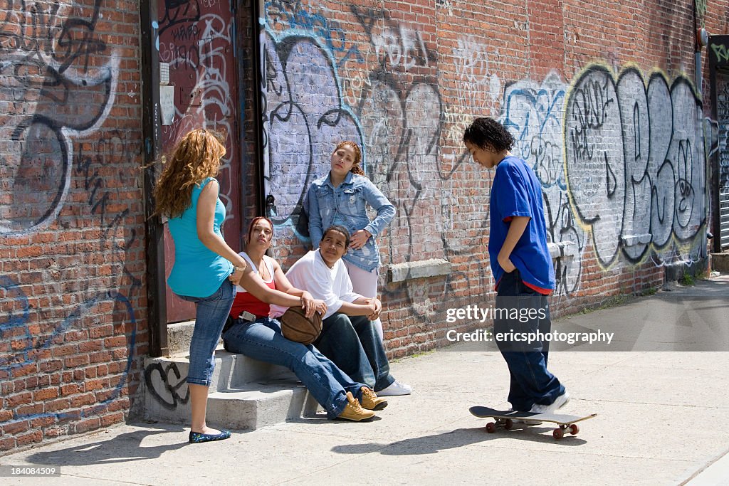 Many neighborhood children sitting on a stoop