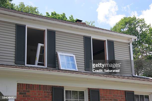 replacement windows being installed in house - window installation stock pictures, royalty-free photos & images