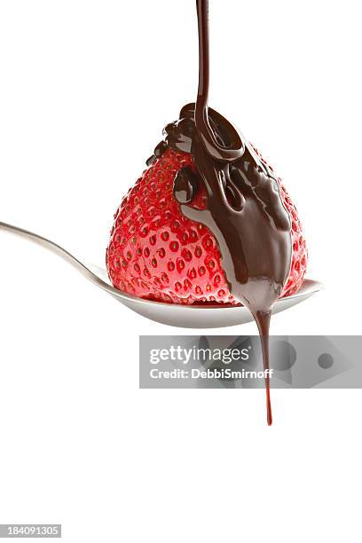 chocolate pouring over strawberry - fudge sauce stock pictures, royalty-free photos & images