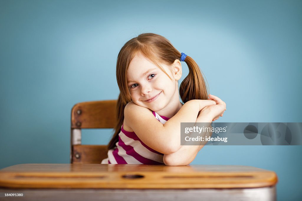 Happy, Shy Young Student Girl Sitting at School Desk